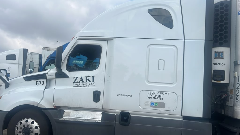 ZAKI Logistics white tractor, unit 570, coupled to a Carrier reefer trailer
